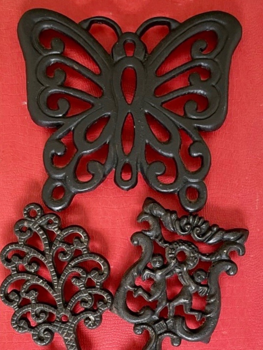 Vintage 1960's set of cast iron trivets,